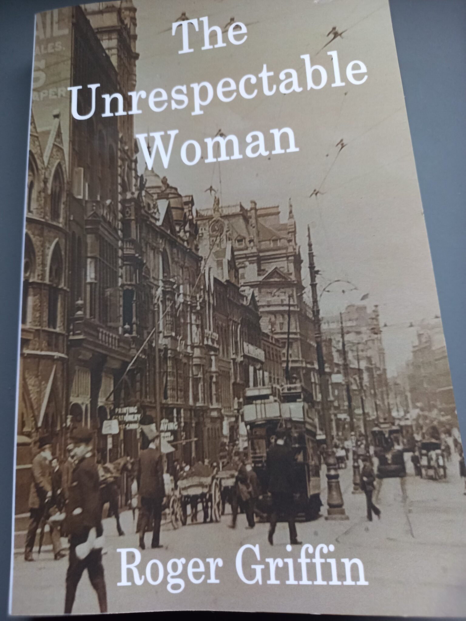 A book cover in black and white of a photo of an Edwardian Cardiff street.